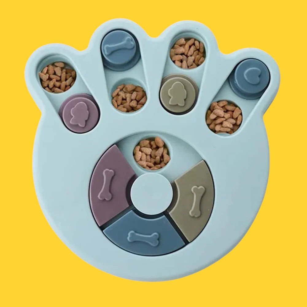 Comedero lent interactif ANIMALZO en forme de patte bleu pastel avec des compartiments puzzle pour stimuler le chien